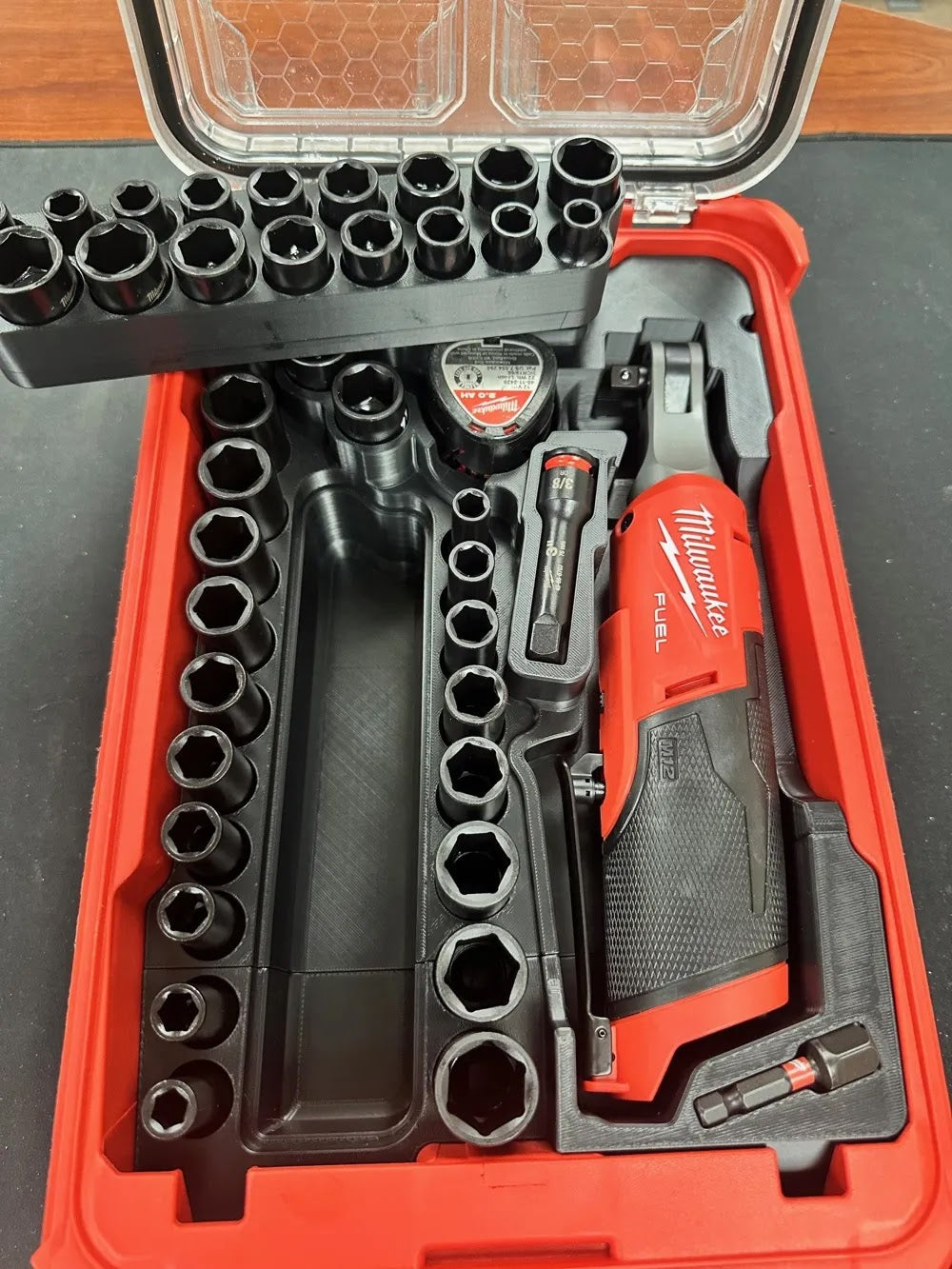 Milwaukee M12 FUELs 3/8 in. HIGH SPEED Ratchet (CAT.NO.2567-20) and Milwaukee SHOCKWAVE 3/8 in. Drive SAE and Metric 6 Point Impact Socket Set (43-Piece) (CAT.NO.49-66-7009).